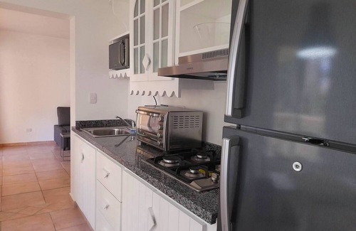 ProCab Apartment | 1-bedroom quiet condo in central Cabarete, TV/WiFi/pool/safe/parking