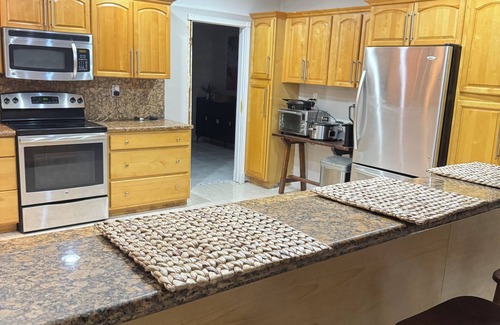 Bahamia West House | 1 King Bed, 2 Queen Beds, 2 Bunk Beds located 1.5 miles from the beach.