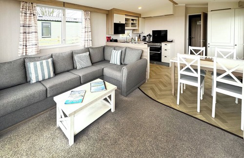 Castle Douglas House | 12ft-wide caravan situated in a coastal position.