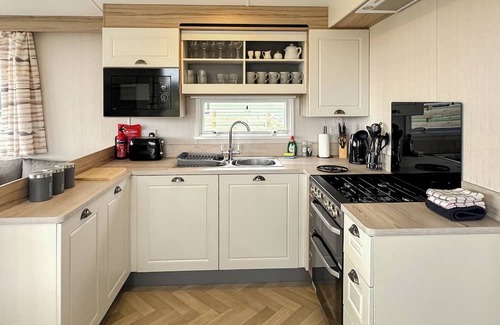 Castle Douglas House | 12ft-wide caravan situated in a coastal position.