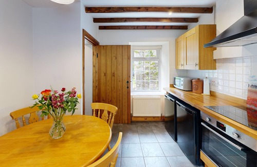 Margam Cottage | 19th century stable with four poster, river views and free WiFi