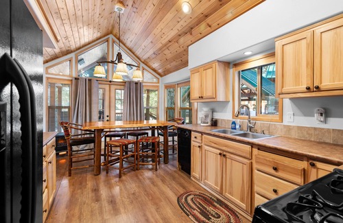 Historic Railroad District Cabin | 2 bedroom cabin, huge deck, lodge-style furnishings.