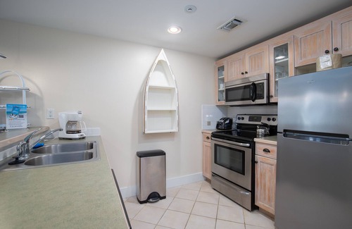 Baytowne Wharf Condo | 2BR Baytowne Condo! Tropical Lagoon Pool/Hot Tub, Tram to Beach, Fitness Room