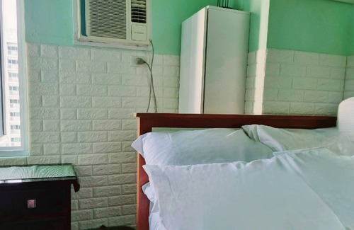 Project 8 Condo | 2Br Deluxe End-Unit Condo with Balcony. Overlooking Amenities. Sunrise Views.