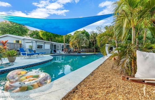 Cocoa House | 3 bed/2 bath house with tropical backyard, pool, fenced yard, hammock