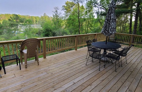 Delton House | 3 bedroom home on a peaceful private no wake lake. With kayaks and floating deck