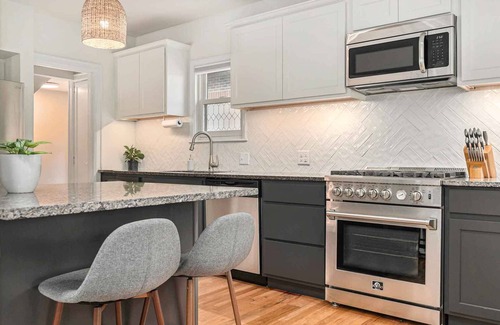 Aksarben - Elmwood Park House | 3 Living Rooms, 2 Garages, Gym & Chef’s Kitchen! Room for the Whole Group!