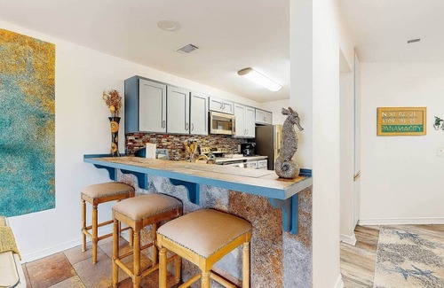 Bel Air Apartment | 3-Story Lagoon Haven: Dock & Resort Amentities