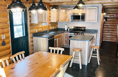 Cook Cabin | 4 bedroom 3 bath Log Cabin with Sand Beach, water toys, sauna, yoga, game room