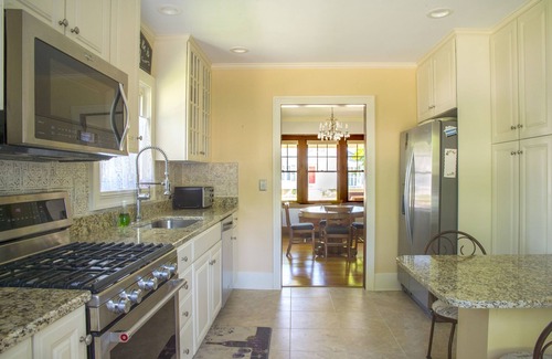 Flushing House | 4 Beds, 4 bathrooms! 1 block to town shops, bars, bowling, canoeing, and parks!