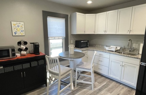 Historic Downtown Racine Apartment | 5 Minutes from Downtown Racine. Private deck, entrance, and driveway.