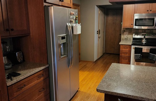 Holt House | 5-Star 3 bedroom home with heated pool and hot tub! 10 minutes away from MSU