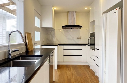 Browns Bay House | 7BR 3BH Beach Escape. 2 min to Browns Bay Beach