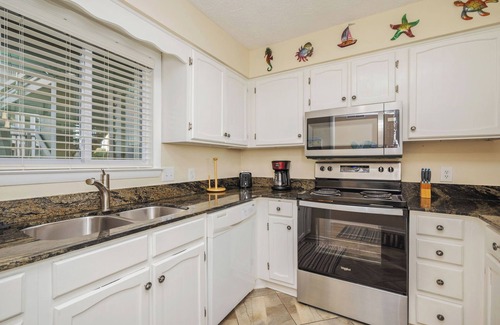 Caswell Beach Condo | A Breath of Heaven: First Floor Condo with Stunning Views, Community Pool, Beach