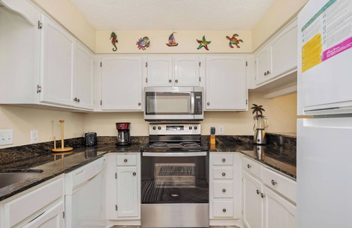 Caswell Beach Condo | A Breath of Heaven: First Floor Condo with Stunning Views, Community Pool, Beach