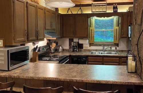 Wolf Laurel House | A fabulous 6 person hot tub located outside on the deck!