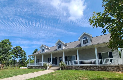 Pomona House | A large country home with scenic views of a working cattle farm & rural locale.