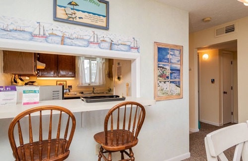 Caswell Beach Condo | A Pelican's Paradise: Condo with Community Pool and Ocean Views