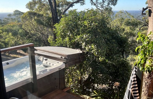 Belair Apartment | A place to relax in peace. Spa, fire pit, city lights and a pool.