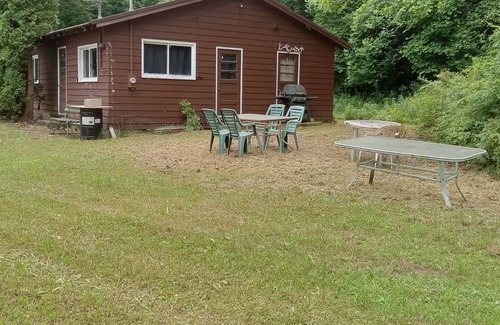 Guys Mills Cabin | A private camp situated on 60 acres. Purple paint for hikers to see huge rocks.