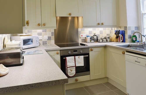 Llanystumdwy Cottage | A spacious detached property with an open fire and enclosed garden.