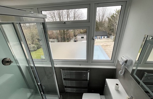 Ewell House | Air-con 6 bed house with pool+cinema+games room