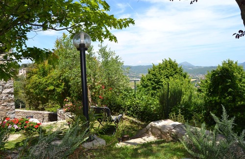 Corciano House | Ancient rock house with garden,situated in the centre,with view of Umbria