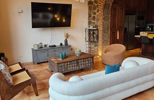 Ciudad Vieja House | Antigua Luxury Stay with Jacuzzi.nRoof top fire pit and those volcano views!