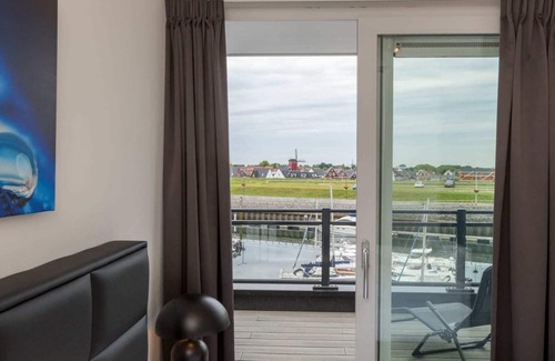 Sint-Annaland Apartment | Apartment in Sint-Annaland with Water Views