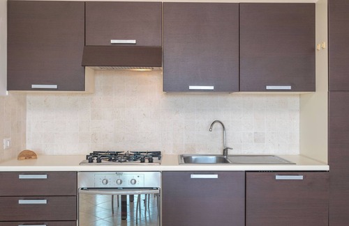 Porto Pozzo Apartment | Apartment 'Il Fiordo 16' with Sea View, Shared Pool and Air Conditioning