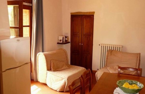 Torrita di Siena Apartment | Apartment with a beautiful covered terrace in front of the pool