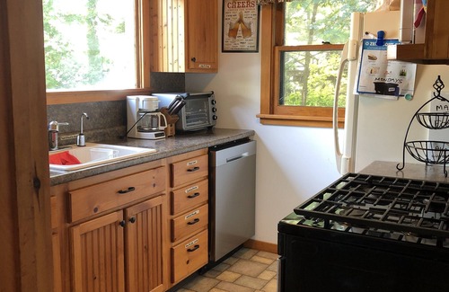Warren County Cabin | Authentic seasonal 1950’s Adirondack live edge /knotty Pine waterfront cabin.