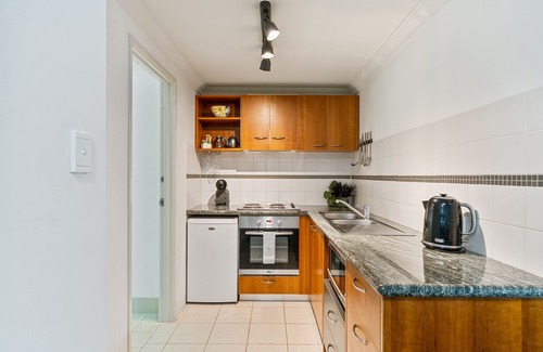 Perth Central Business District Apartment | Balcony, bath, kitchen, laundry, pool, tennis court, gym, designated car bay
