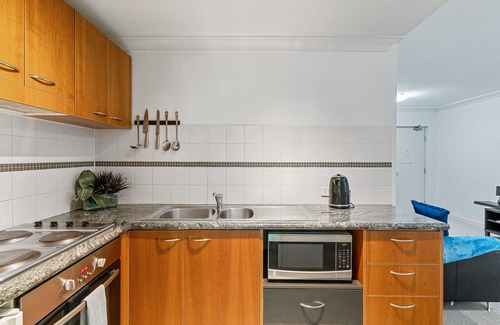 Perth Central Business District Apartment | Balcony, bath, kitchen, laundry, pool, tennis court, gym, designated car bay