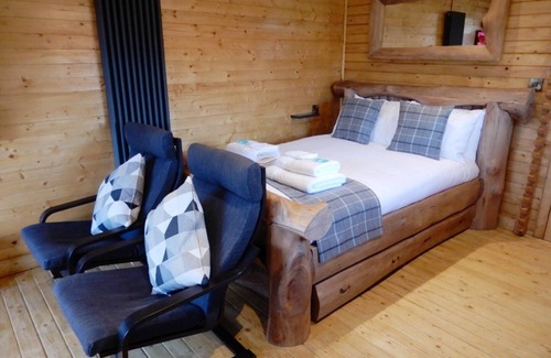 Welsh Frankton Cabin | Balmoral Studio Lodge 2 Birth Log Cabin With Lake Views & Private Hot Tub