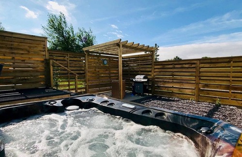 Llansantffraed Ski Chalet | Bay view lodge offers just that, breathtaking views of Ceredigion Bay.
