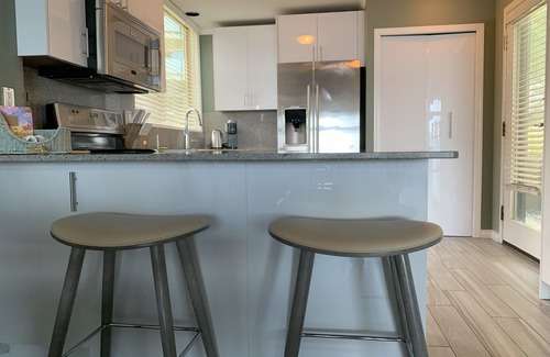 North Oyster Condo | Beach Bliss oceanfront king suite! View, pool, hot tub & dock. Great Fall rates