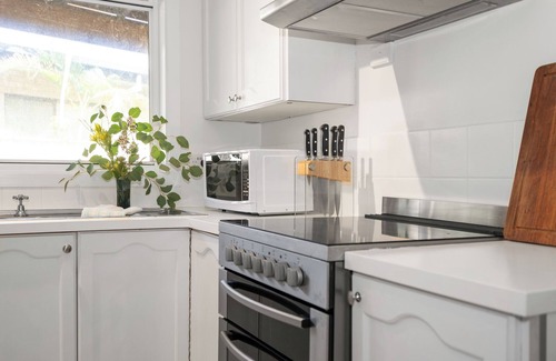 Emerald Beach House | Beach Cockatoo, Sleeps 4, start your day with a surf or walk on the beach