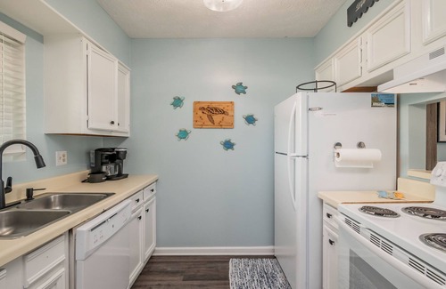 Caswell Beach Condo | Beach Therapy: Oceanfront Condo with Seasonal Community Pool