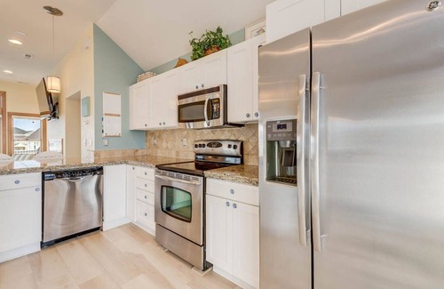 Buck Island House | Beachin Fun (North Unit) | 1665 ft to the beach | Hot Tub, Dog Friendly, and Community Pool