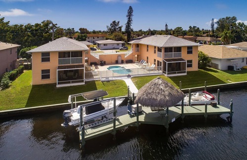 Pelican Apartment | Beautiful 4 unit building on Lake Louise with a private pool.