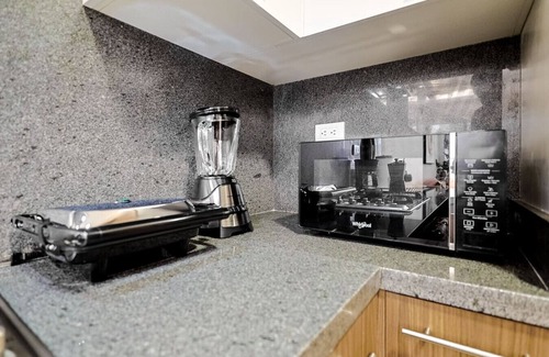 Evaristo Morales Apartment | Beautiful and Cozy 1BR Centric Condo, Full AC, King Bed, Pool.