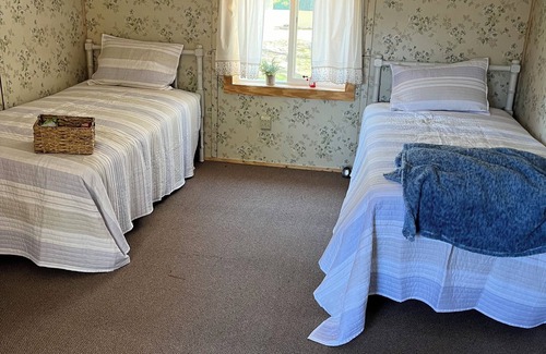 Hawks Cabin | Beautiful bird watcher’s paradise in Northeast Michigan on lovely Lake May.