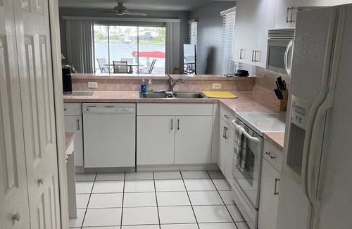 Pelican Apartment | Beautiful complex on Lake Louise private pool and pier