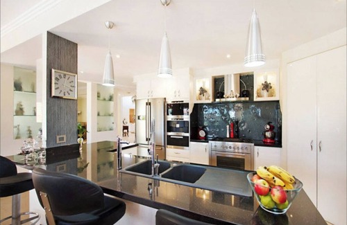 Bundall House | Beautiful Family Home with Heated Pool on the Water