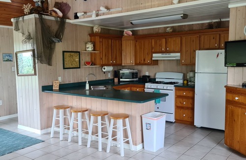 Hope Town Villa | Beautiful home with wifi, tv, A/C, private dock, & backup generator power