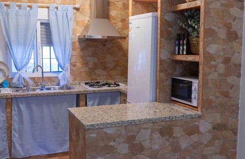 Almodovar del Rio Ski Chalet | Beautiful house with natural caves and salt water pool