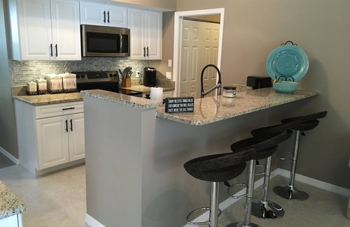 South Gulf Cove House | Beautiful relaxing waterfront home with pool, spa and boat dock.