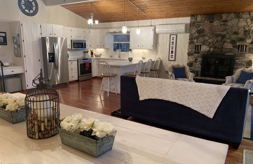 East Jordan House | Beautiful sloping view to water's edge on this Lake Charlevoix South Arm escape.