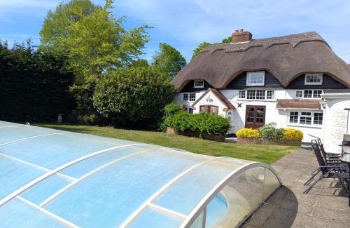 Chichester House | Beautiful Thatched Cottage with Outdoor Pool, Secure Garden, Dog & Family Friendly! Chichester Holiday Properties